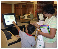 Patrons using self-checkout machine